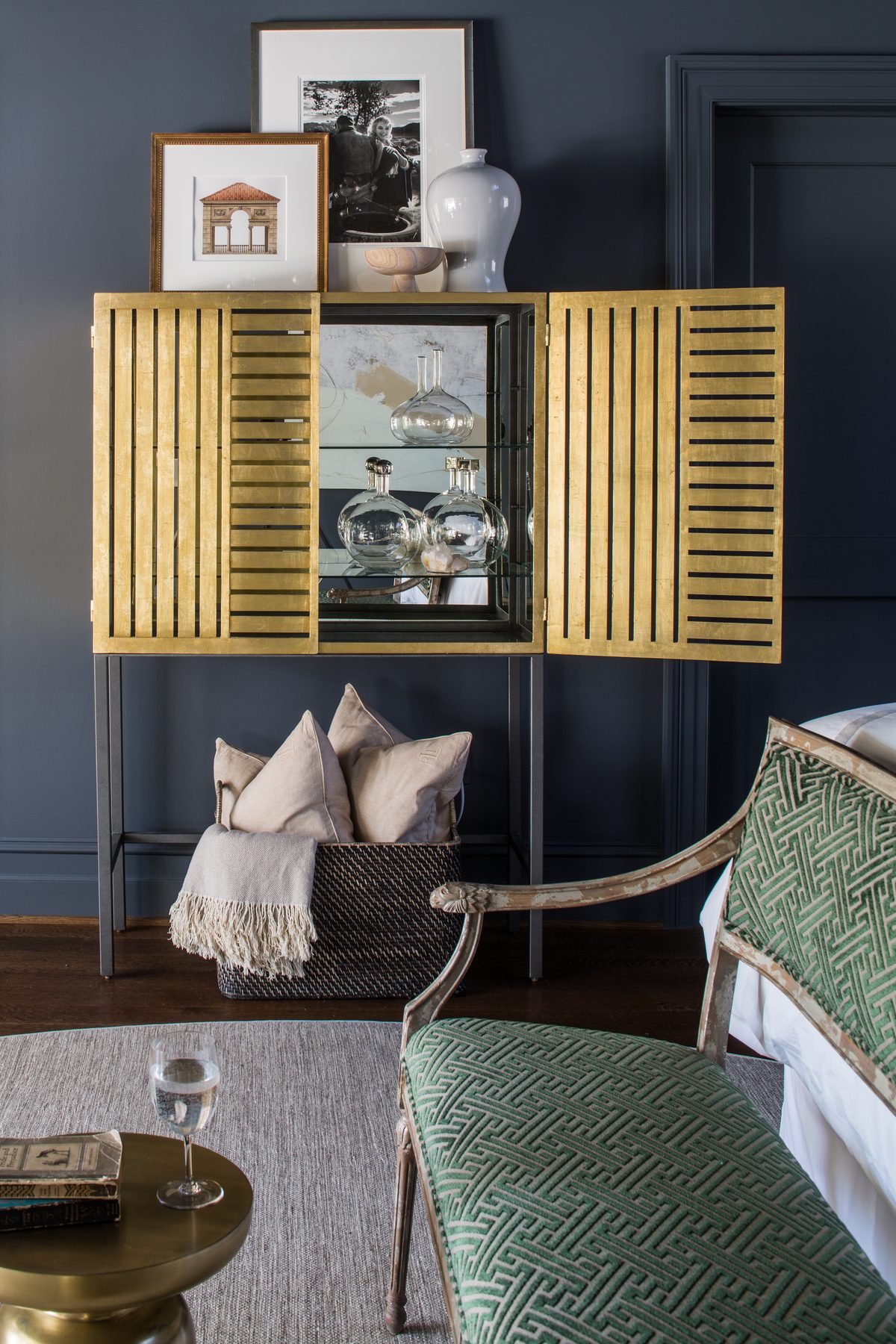 Tailored study and suite with lacquered walls, tobacco leather, and brass — DC Design House by Christopher Patrick Interiors