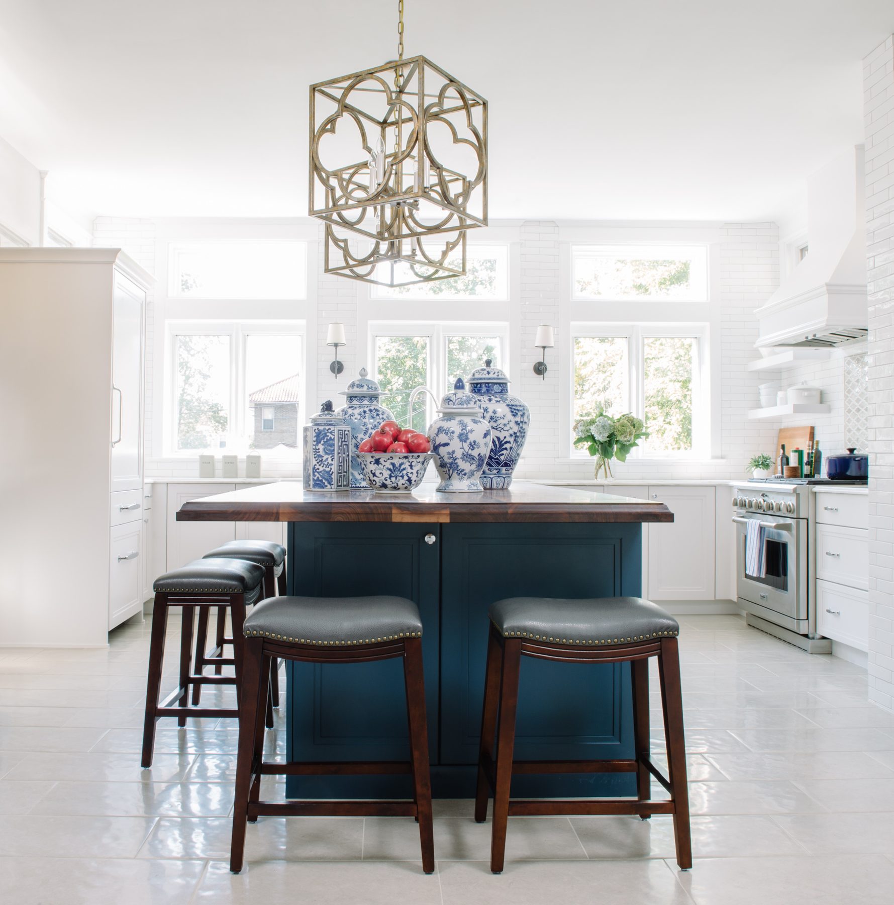 White kitchen with Blue Lagoon navy island and unlacquered brass — the Southern Living kitchen by Christopher Patrick Interiors, Washington, DC