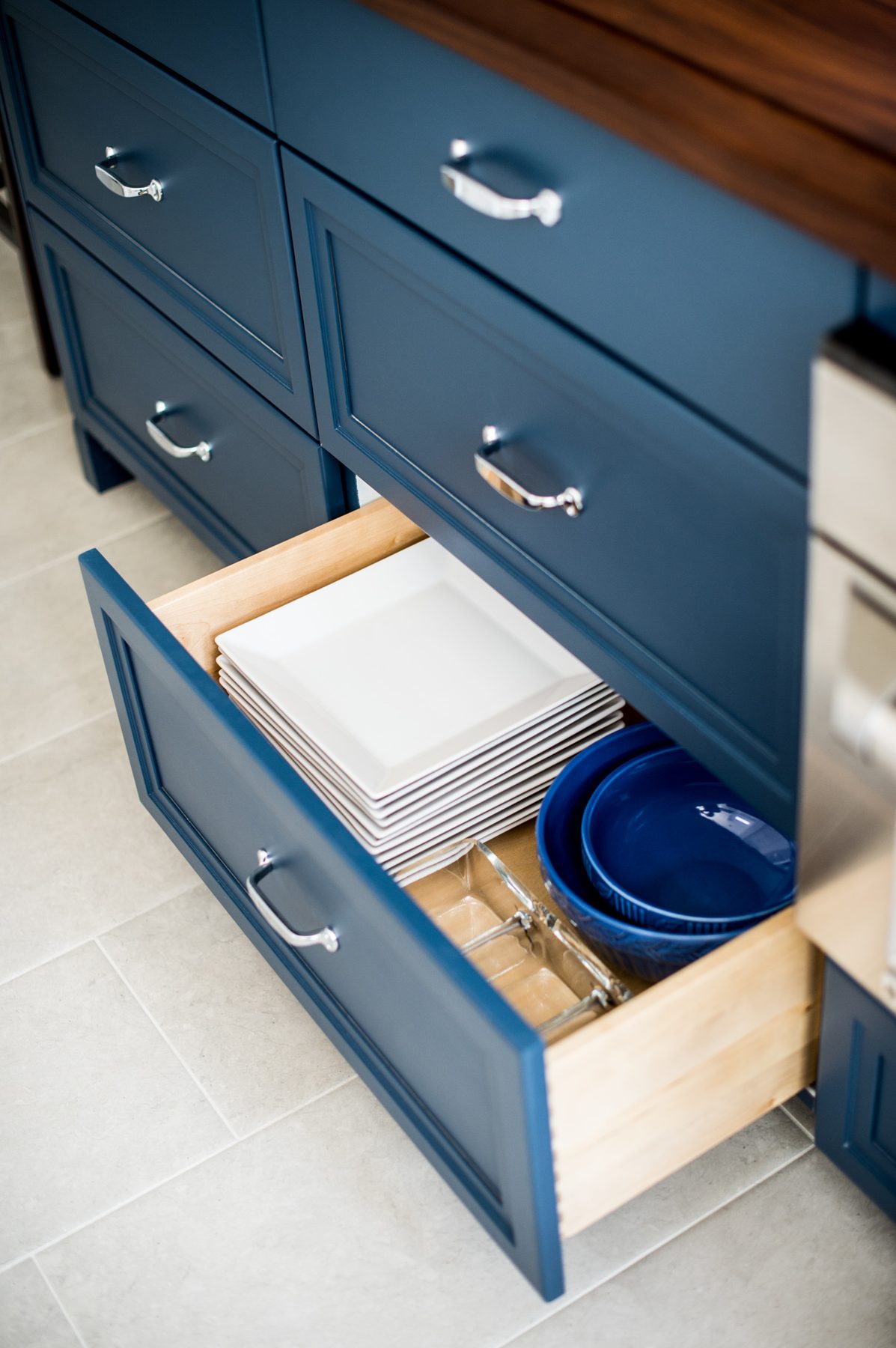 White kitchen with Blue Lagoon navy island and unlacquered brass — the Southern Living kitchen by Christopher Patrick Interiors, Washington, DC