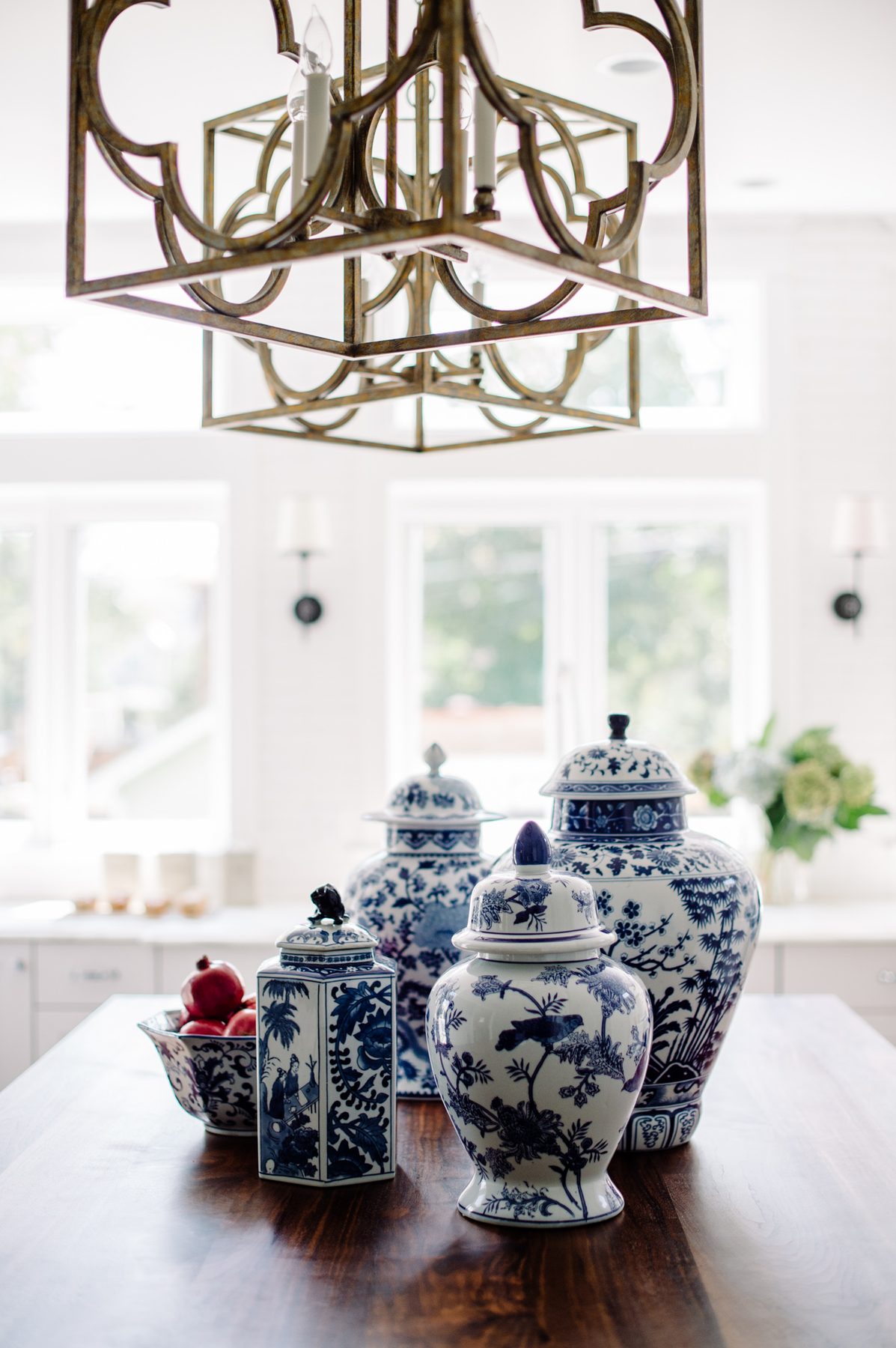 White kitchen with Blue Lagoon navy island and unlacquered brass — the Southern Living kitchen by Christopher Patrick Interiors, Washington, DC