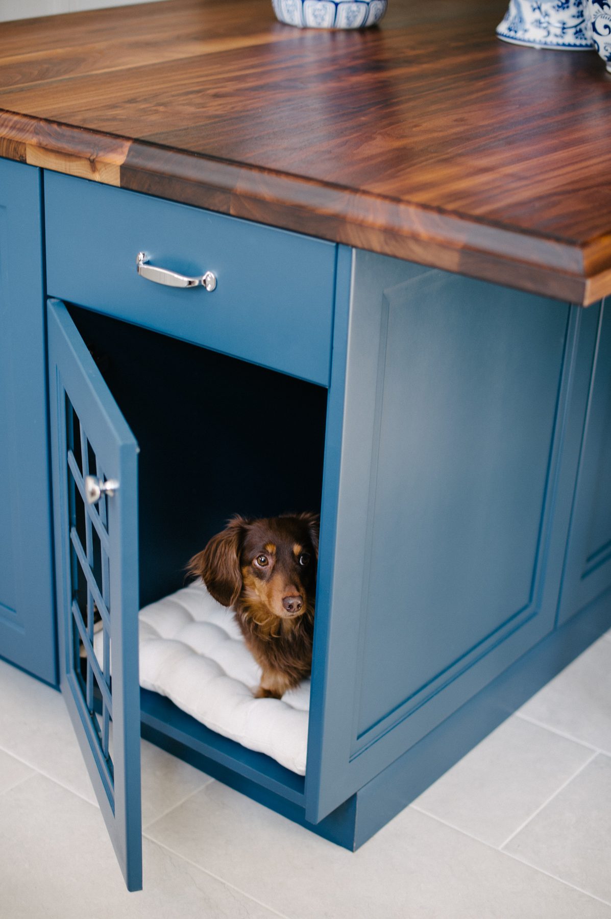 White kitchen with Blue Lagoon navy island and unlacquered brass — the Southern Living kitchen by Christopher Patrick Interiors, Washington, DC